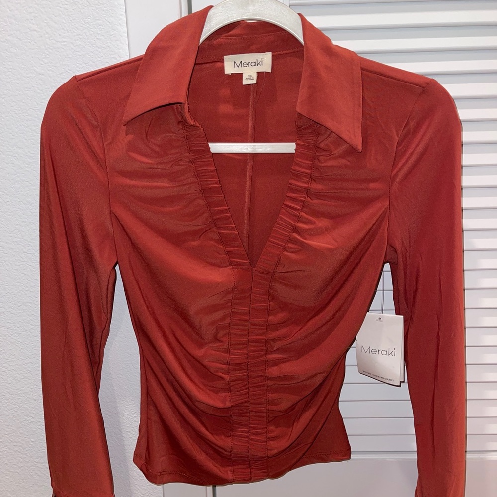 Pink/coral top.